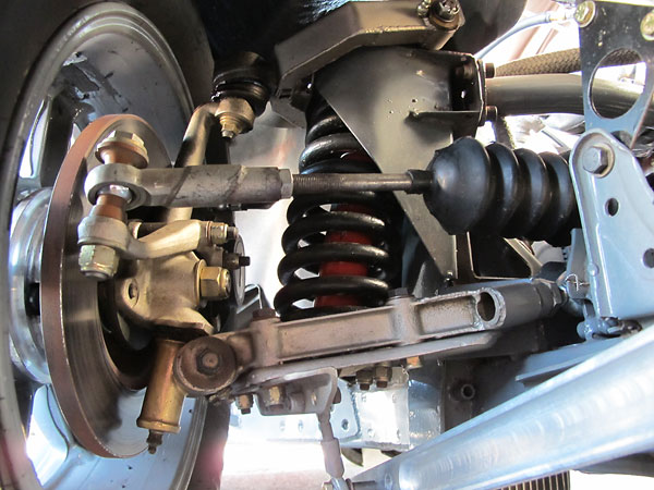 Stock lower control arms modified with Heim joints on inboard side for adjustability.