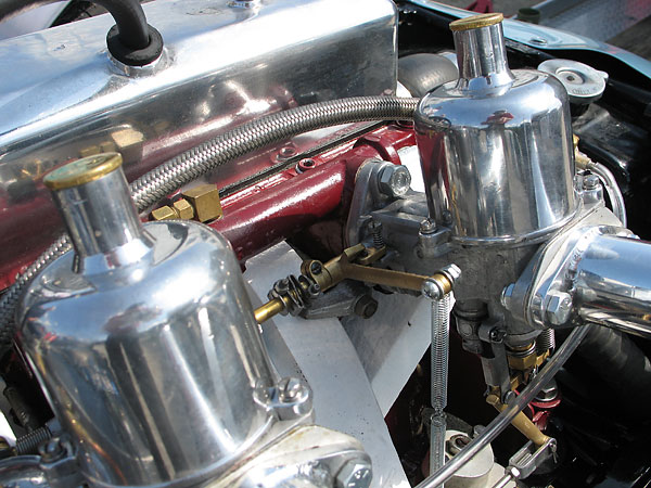 Twin 1.12 inch S.U. carburetors with long velocity stacks.
