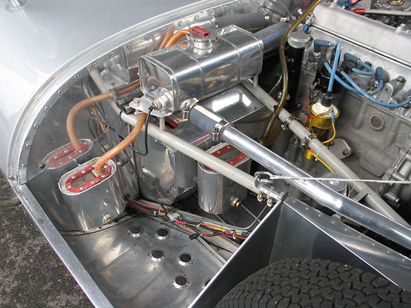 Notice the pressurized coolant header tank, high on the firewall where it belongs.