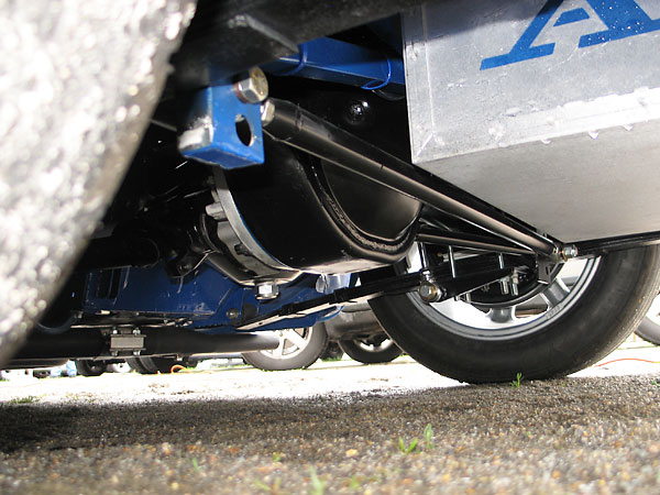 Carrera telescoping shocks, inverted so proportionally more weight is unsprung.