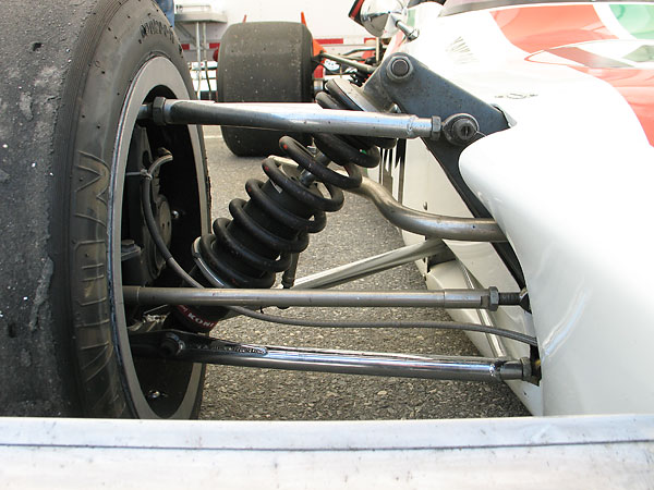 Interestingly, a third member connects the inboard arms of the wishbone yet the anti-sway bar connection comes in at mid-span unsupported.