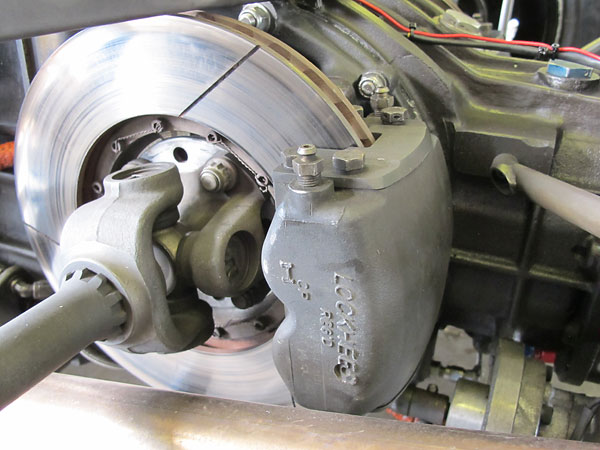 Lockheed four-piston brake caliper with 10.5 inch vented rotors, inboard-mounted.