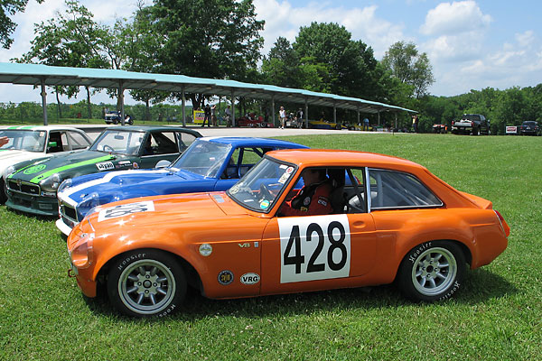 Storm's car lined up with three other MGB GT V8 racecars at Virginia International Raceway in 2009.
