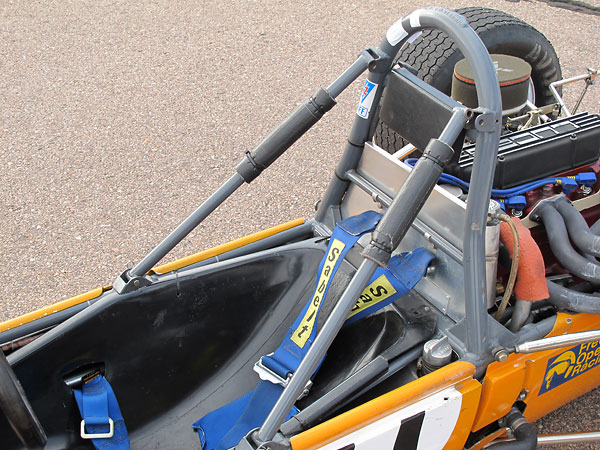 The roll hoop braces pivot out of the way for drivers seat removal.