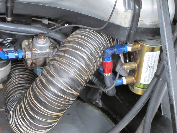 Holley adjustable fuel pressure regulator. Facet Bendix-style electric fuel pump.