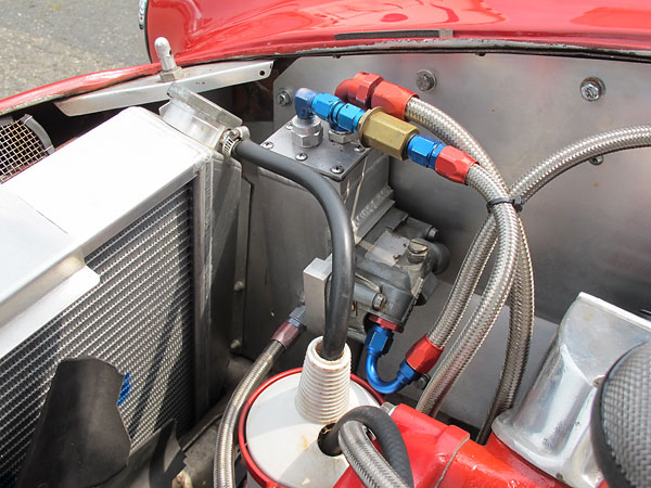 Custom aluminum fuel make-up tank featuring a primary float bowl borrowed from a center-hung-float Holley carburetor.