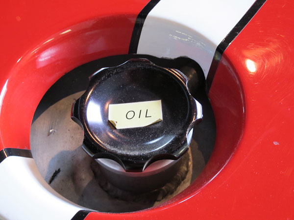 The original engine oil reservoir is in its stock location on the passenger side.