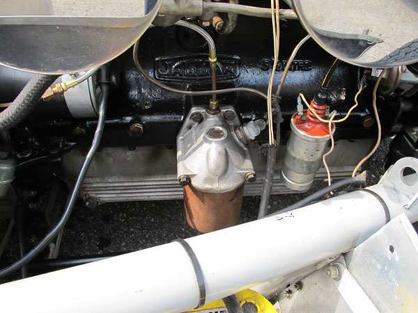 Oil filter. Note also finned aluminum oil pan, in background.