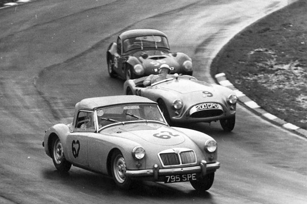 Colin Hextall races Bill Shaw and W. Evangelista at Brands Hatch's Easter Meet, 3 April 1961