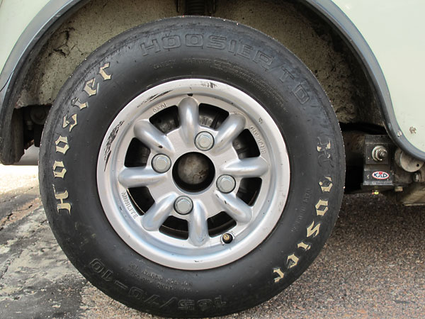 Minilite 10x6 8-spoke aluminum rear wheels and Hoosier T.D. 165/70-10 tires.