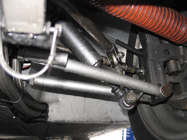Carrera steel bodied shock absorber... layed way over to fit underneath the leaf spring.