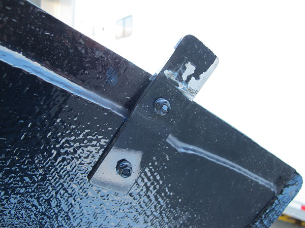 Flat metal tabs retain the back end of the bonnet (here) and the front end of the boot lid (below).