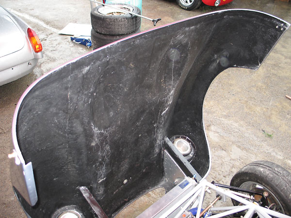 The Ginetta G4 fiberglass bonnet pivots forward for excellent access to the engine.