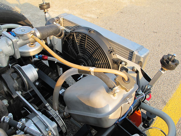 Huge stainless steel coolant overflow tank.