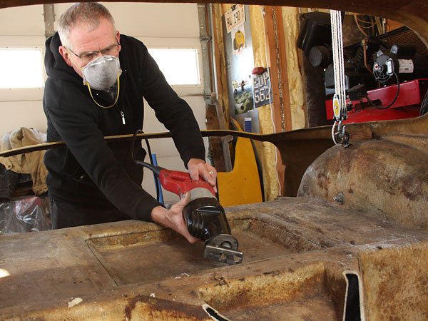 Dennis cuts an access hole that will facilitate easily servicing the differential.