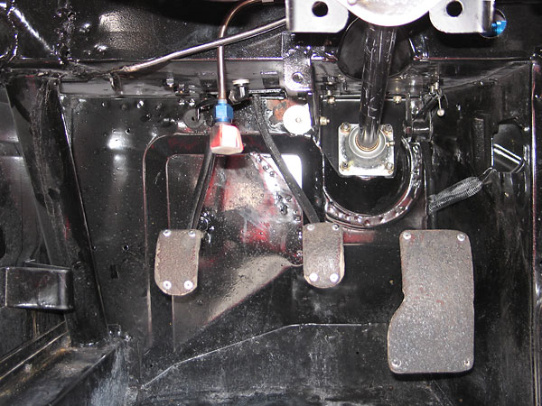 Enlarged throttle pedal surface, altered pedal spacing... and a dead pedal has been installed.