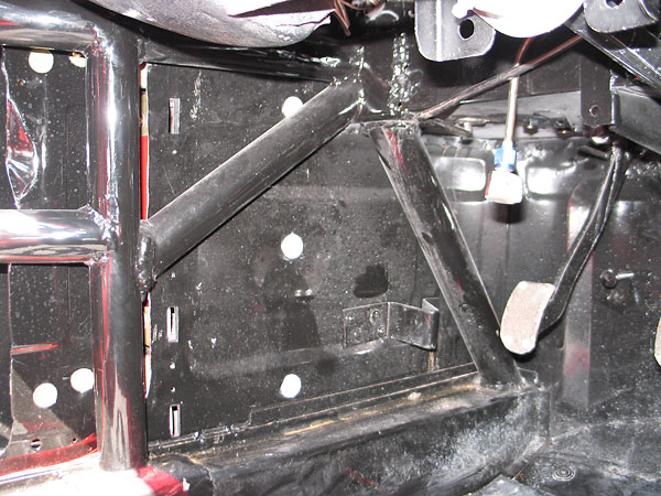 The roll cage extends further forward to protect the footbox area.
