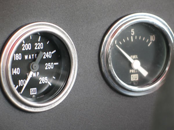 Stewart Warner water temperature (100-265F) and fuel pressure (0-10psi) gauges.