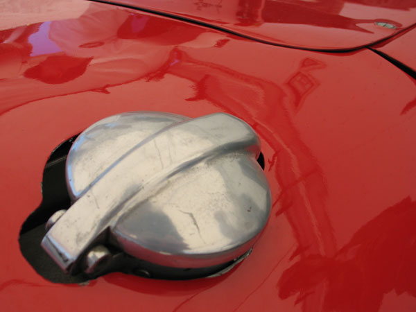 A vintage style filler cap tops an authentic eight gallon aluminum fuel tank.