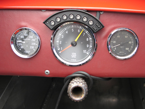 Traqmate Shift-I progressive gear shift and RPM range indicator installed atop a VDO tachometer.