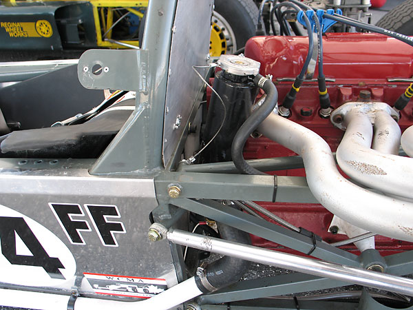 The filler cap is up high to ensure that coolant fills the cylinder head's water jacket.