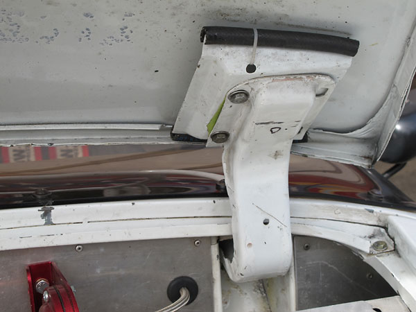 Hinges are connected to the bonnet with quick-release pins.