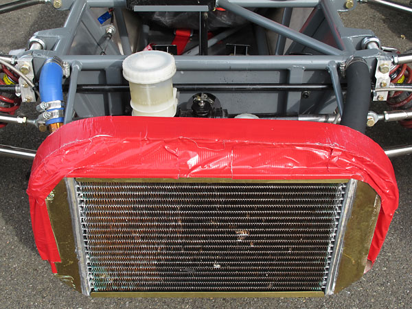 Alexis Mk14s came with combined water and oil copper/brass radiators. (Here, the oil cooler isn't in use.)