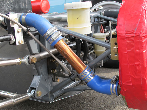 Engine coolant is routed through the upper longitudinal frame tubes.