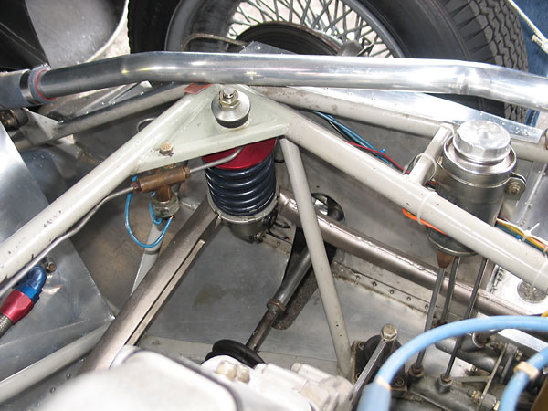 The swing axles are supported longitudinally by long Ford Y model radius arms.