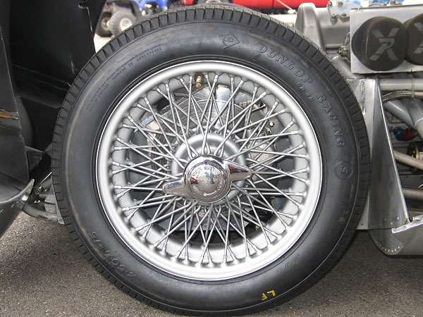 Dayton 72-spoke 15x5 wire wheels with Dunlop Racing bias-ply tires.