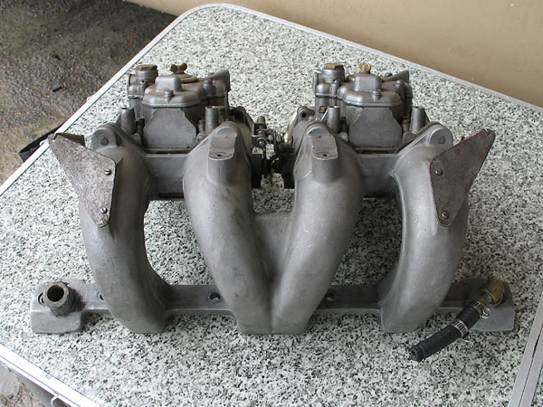 Back of the John Eales swan neck manifolds and Weber carburetors.