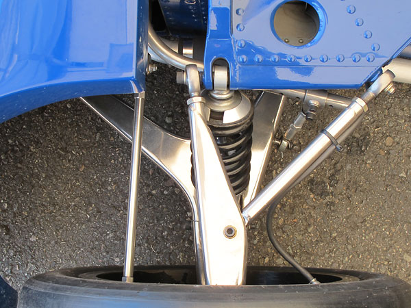 Wide-based one-piece lower control arms mount to the tubular steel radiator subframe.