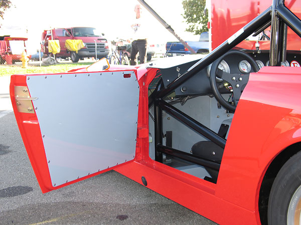 Aluminum door panel. Note also that the door latch has been replaced with simpler mechanism.