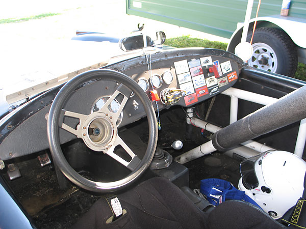 A Petty bar braces the main roll hoop, extending forward diagonally toward the passenger footwell.