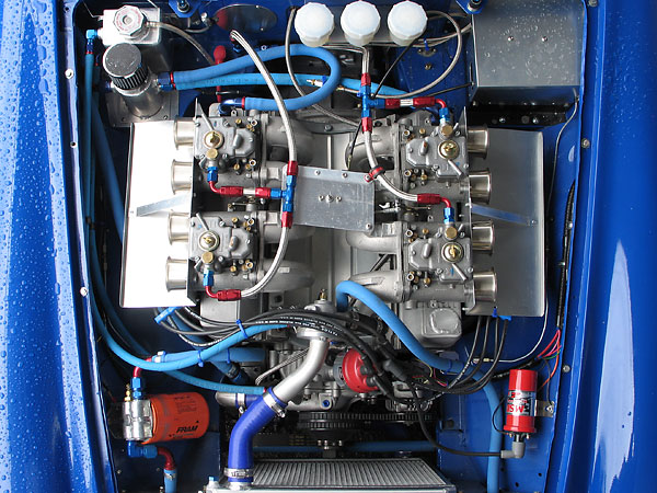 Four Weber 50DCOE carburetors mounted on JE Developments swan neck manifolds.