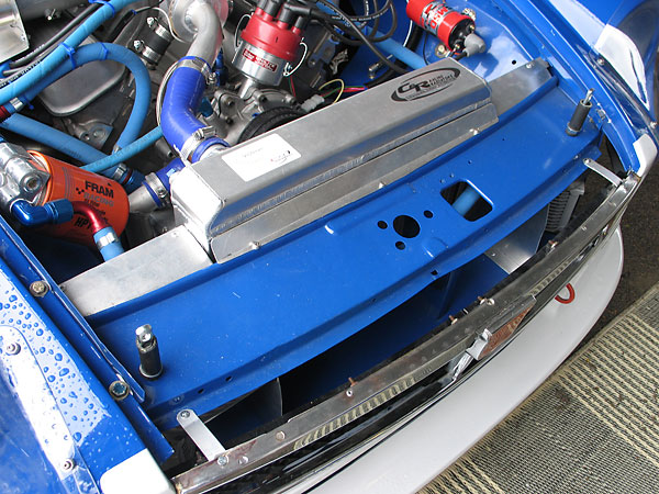 A simple filler strip ducts airflow between the stock slam panel and the radiator core.