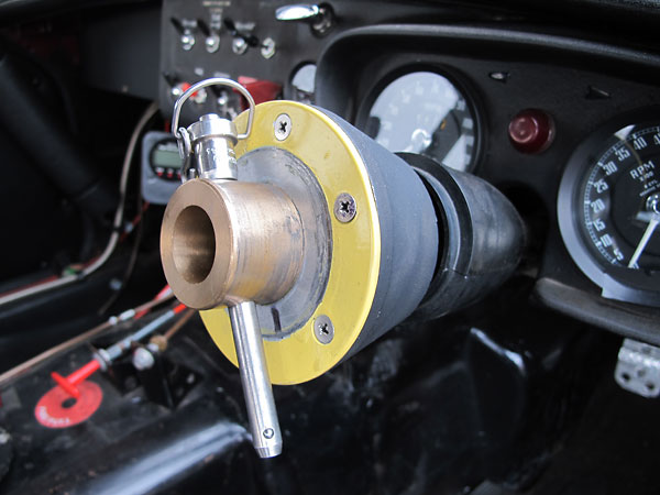 A large pip pin secures the steering wheel hub to the steering column.