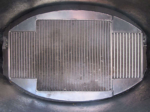 Aluminum radiator with integral oil cooler. (The oil cooler is on the righthand side, as viewed here.)