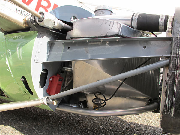 The red plastic device at left is a transponder which works with the track's timing/scoring system.