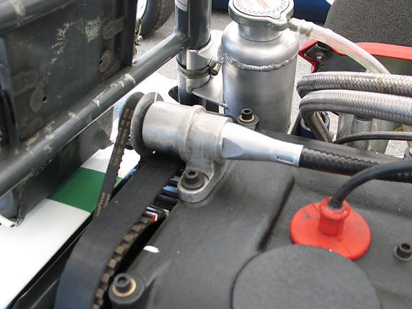 Fuel metering is timed based on a cogged belt driven from the exhaust-side camshaft.