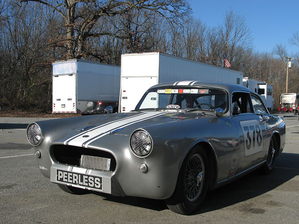 For racing, the original sylized-P radiator trim has been removed from Mark's Peerless GT.