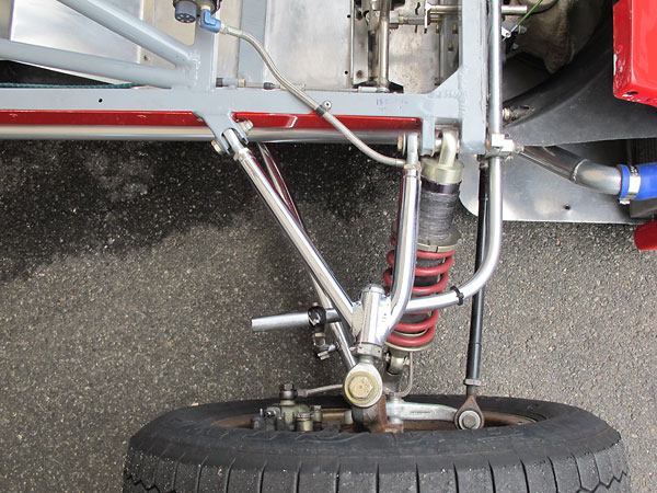 Outboard shock absorbers are usually oriented perpindicular to a car's longitudinal axis.