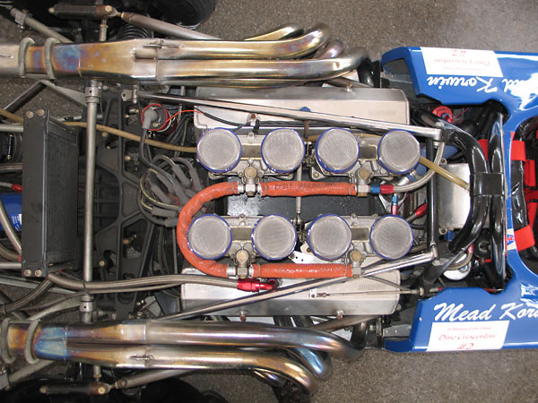 Roll hoop braces spanned rearward across the engine, and connected to a new magnesium crossmember.