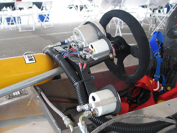 On the Lola T192, instruments are mounted to a simple arch constructed of steel box tubing.