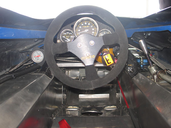 AutoMeter Carbon Fiber Ultra-Lite water temperature, tachometer, and oil pressure gauges.