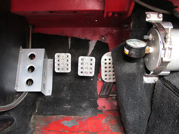 Fabricated aluminum dead pedal. OMP billet aluminum pedal surfaces.