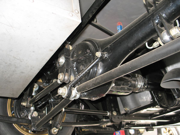 The Watts linkage's bellcrank pivots on a stud that extends from the differential housing.