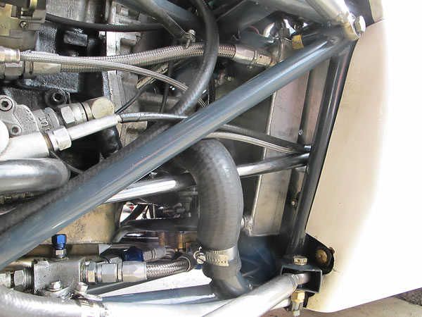 Engine coolant and oil are routed through frame tubes.