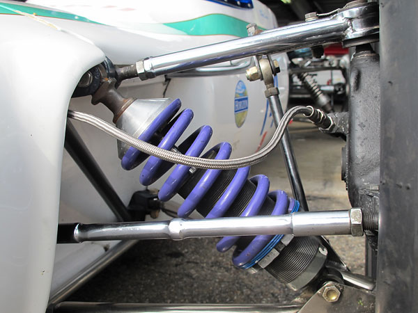 A thin Faulkner helper spring prevents the main spring from rattling loose when the suspension is at full droop.