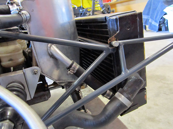 An oil cooler is integrated into the radiator assembly.